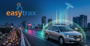 A silver sedan drives on an elevated highway at dusk in a modern city, with digital graphics of a satellite and data streams, and the easytrax logo in the background.